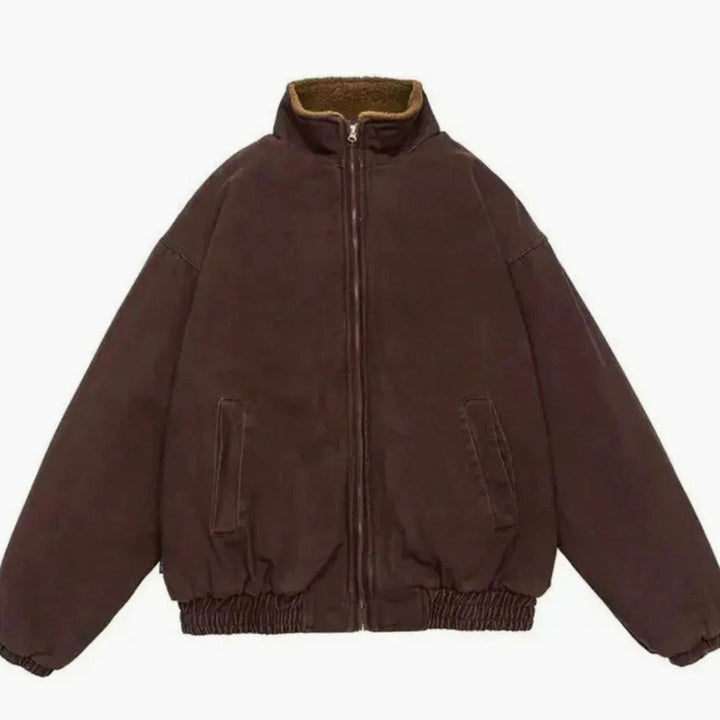 Front view of the oversized bomber zipped up with elasticated hem