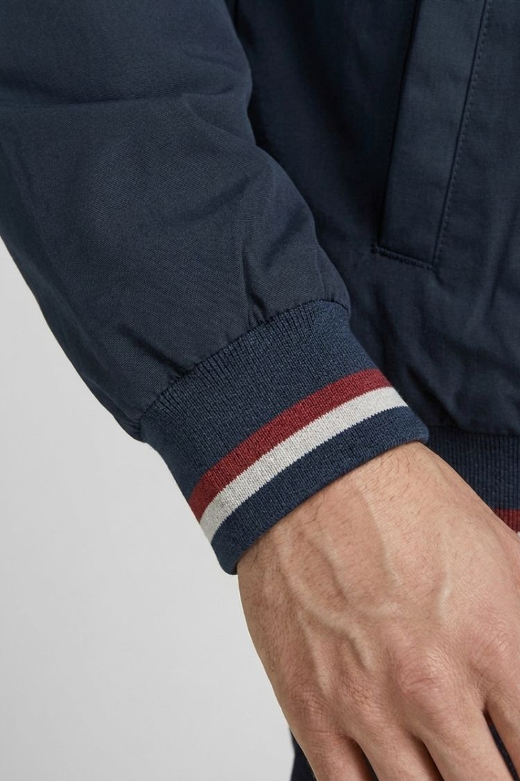 Navy sleeve cuff with red and white tipping stripes