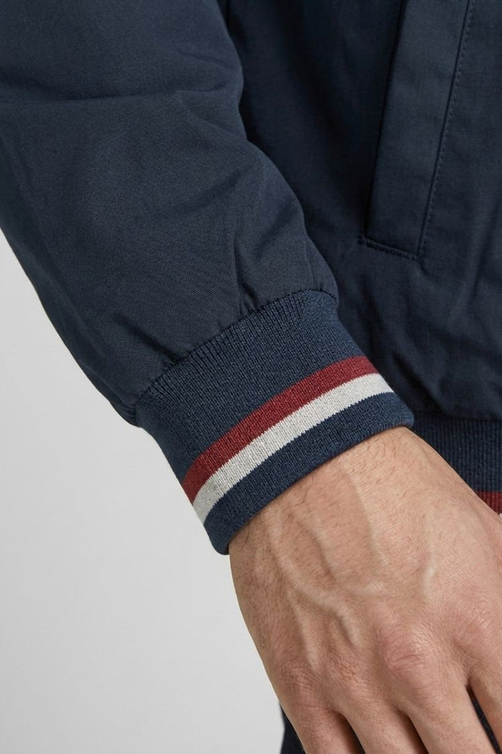 Navy sleeve cuff with red and white tipping stripes