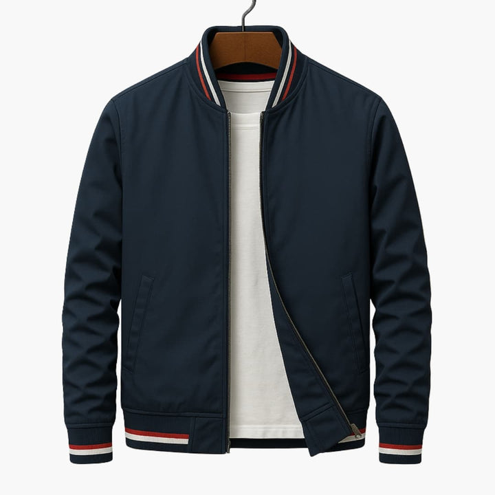 Navy bomber jacket on a hanger with striped collar and cuffs