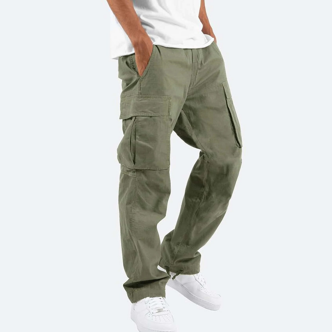 Khaki Green cargo trousers worn with a white tee and trainers