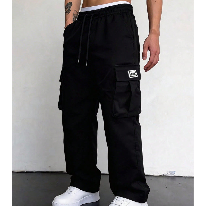 Men's wide leg cargo trousers in black, elastic drawstring waist and flap pocket