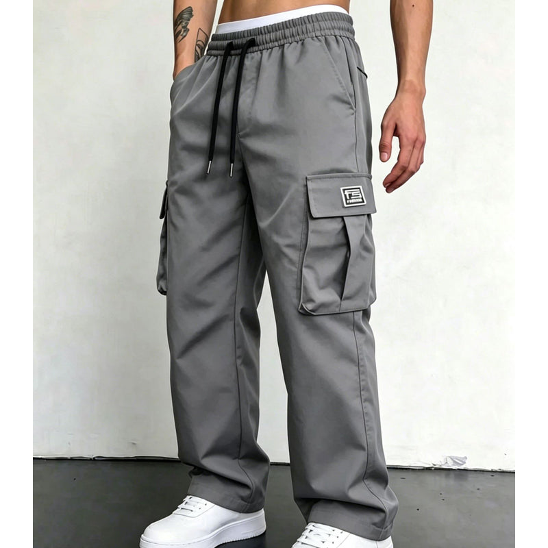Dark Grey wide leg cargo trousers worn with white trainers