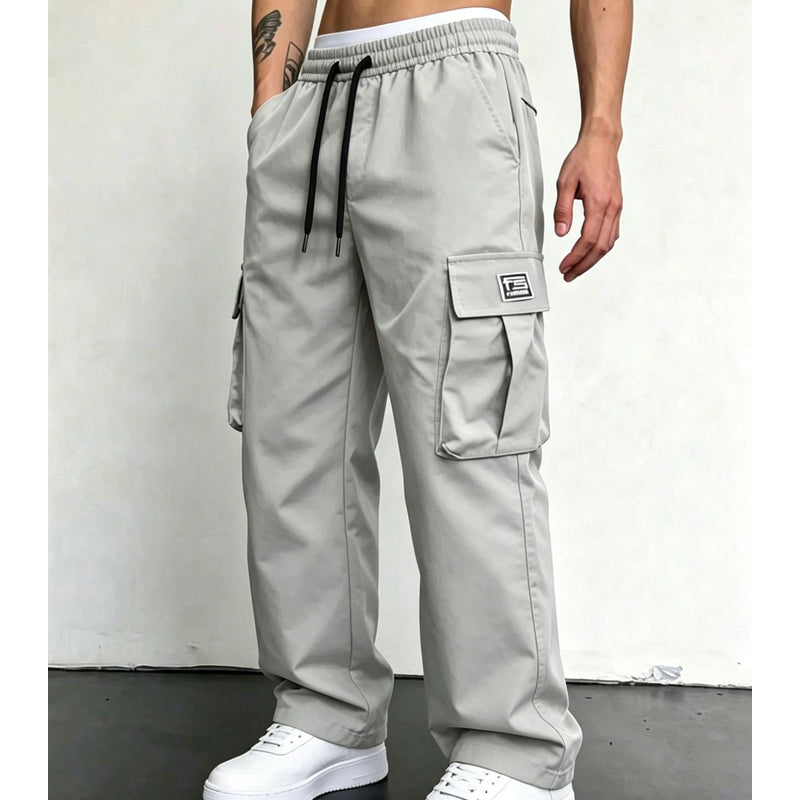 Light Grey wide leg cargo trousers worn with white trainers