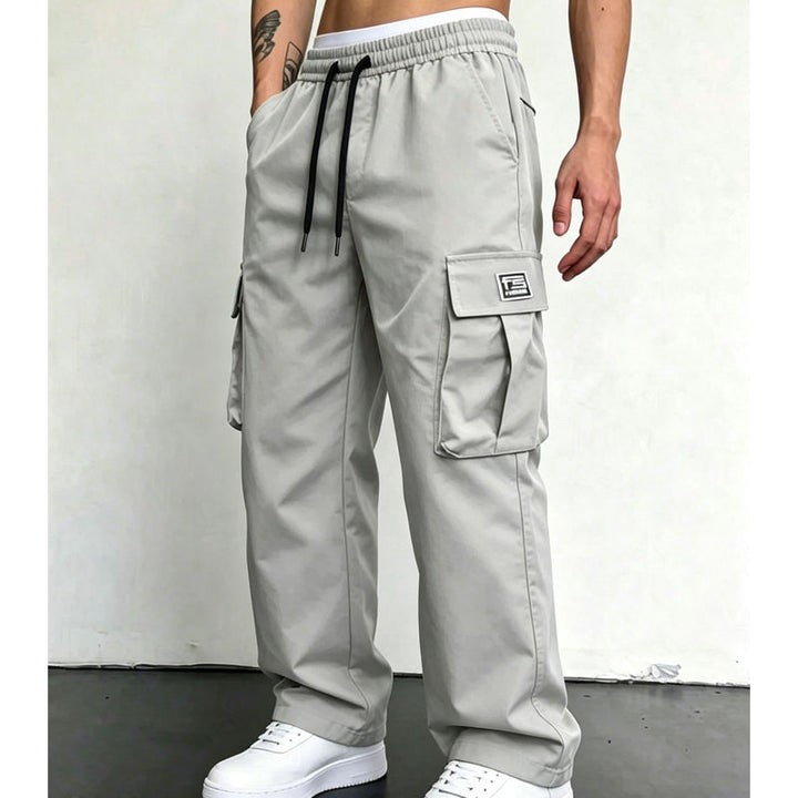 Light Grey wide leg cargo trousers worn with white trainers