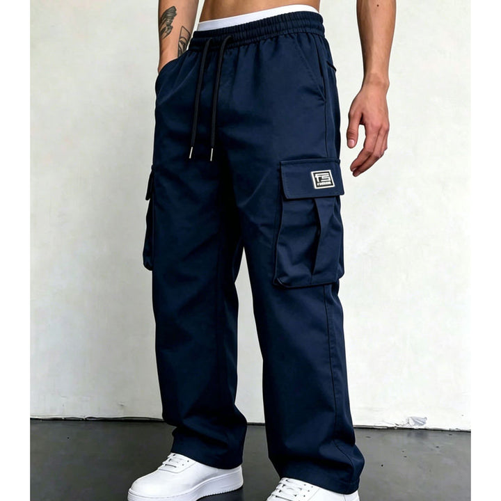 Navy wide leg cargo trousers worn with white trainers