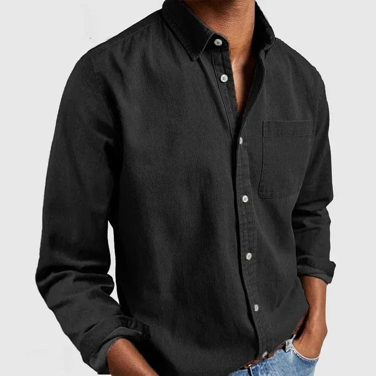 Black casual shirt with point collar and chest pocket, worn untucked