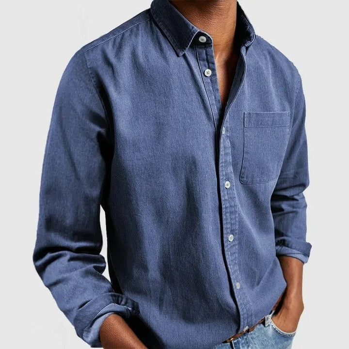 Blue casual shirt with point collar and chest pocket, worn untucked