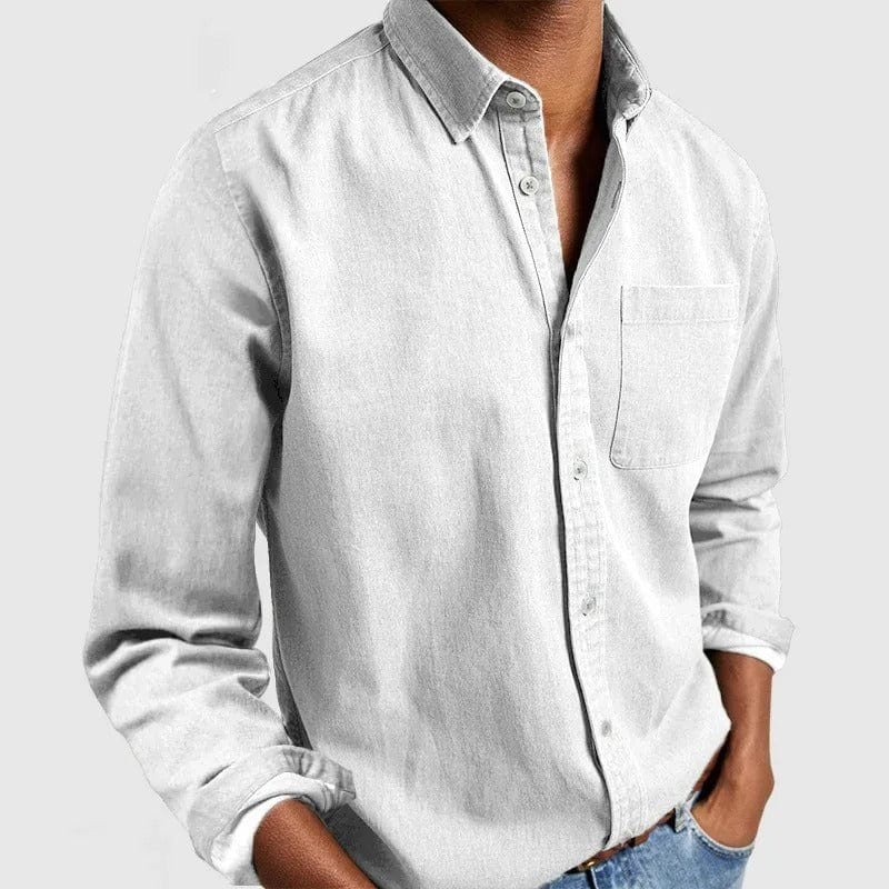 White casual shirt with point collar and chest pocket, worn untucked