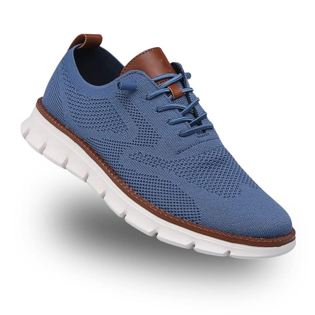 Blue knit lace-up trainer with tan heel tab and white sole, three-quarter view