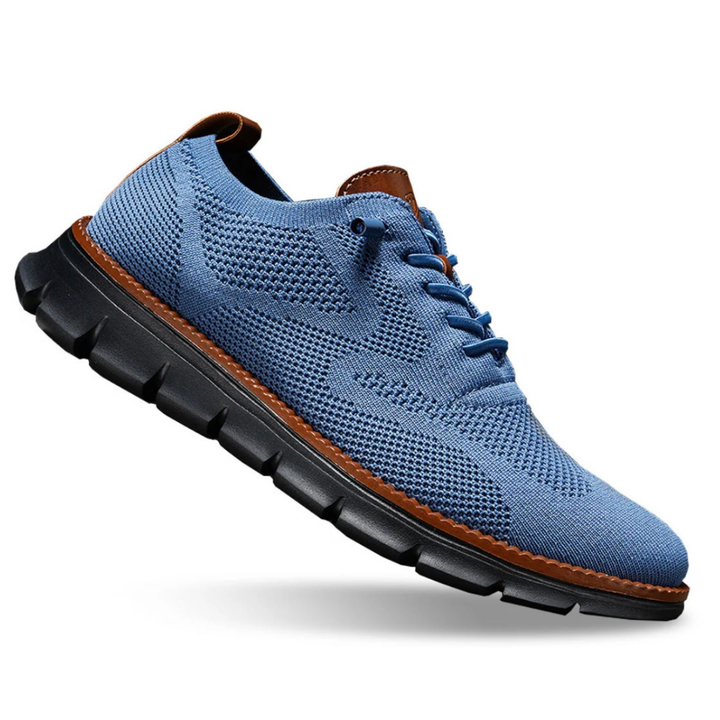 Blue knit lace-up trainer with a black sole and brown stitched edge, three-quarter view