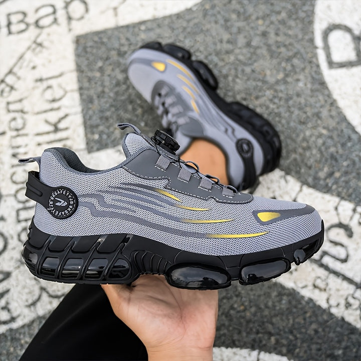Grey mesh trainer held in a hand showing the thick ridged sole