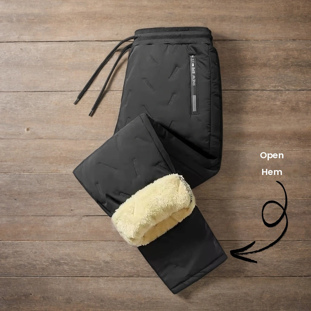 Black trousers with open hem folded to show the lining