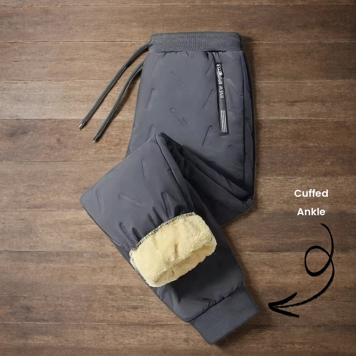 Dark grey joggers with cuffed ankle and zip side pocket