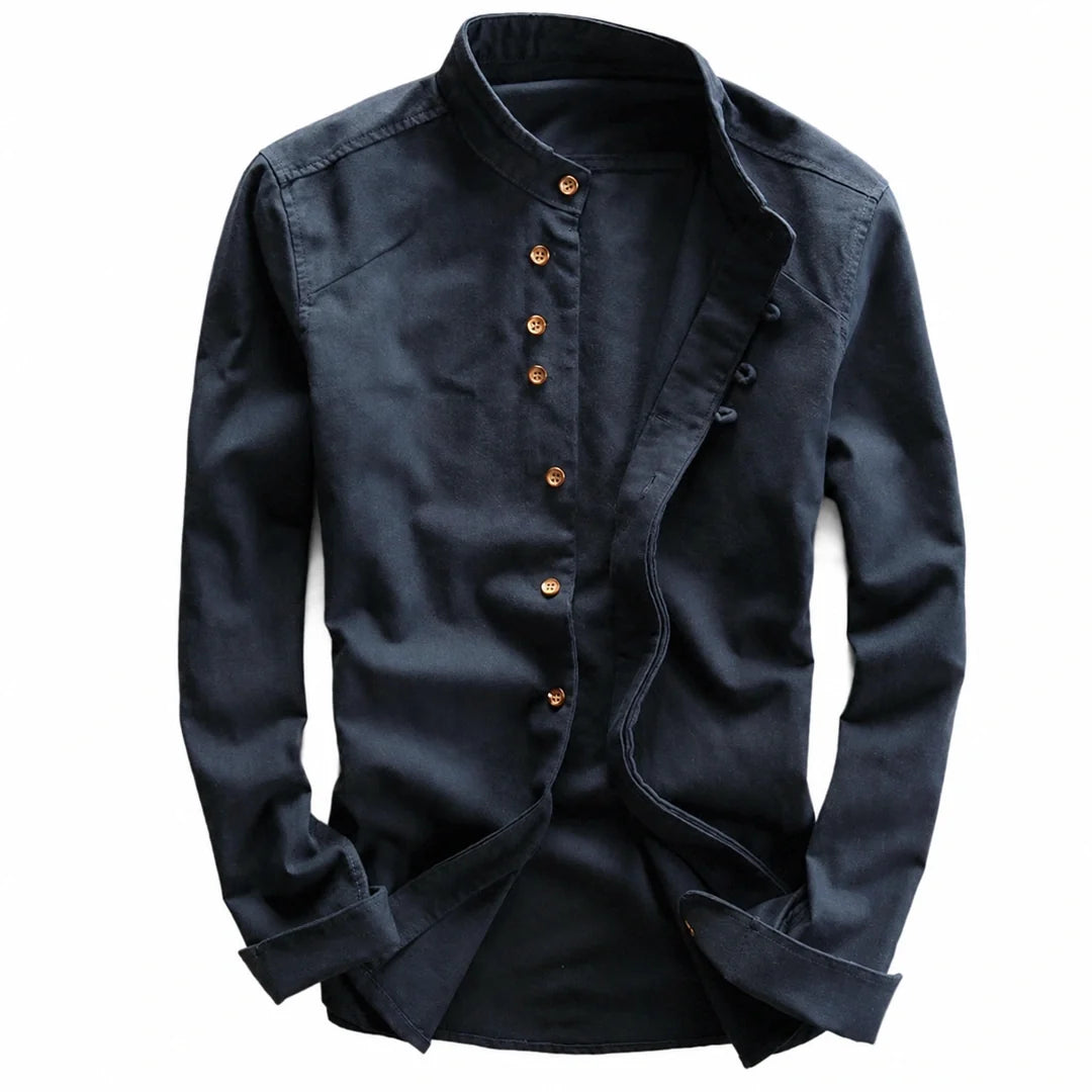 Navy long sleeve shirt laid flat showing the row of brown buttons