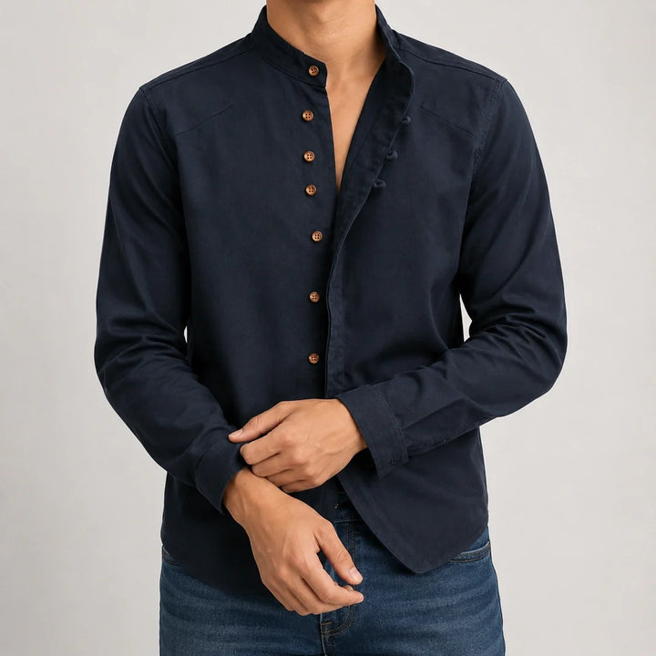 Navy long sleeve grandad collar shirt worn open with hands together