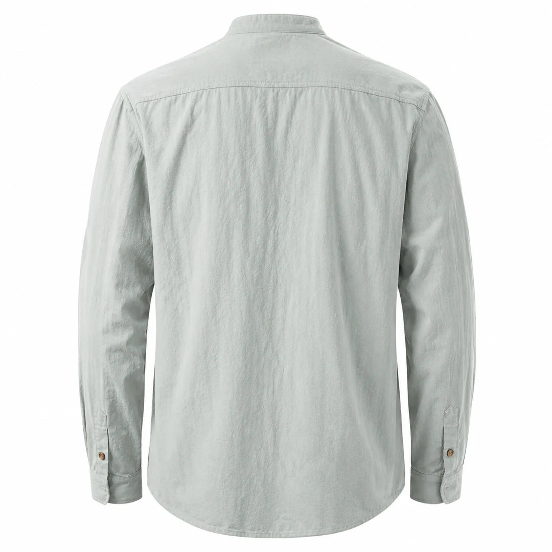 Back view of a sage green long sleeve shirt with a shoulder yoke and curved hem