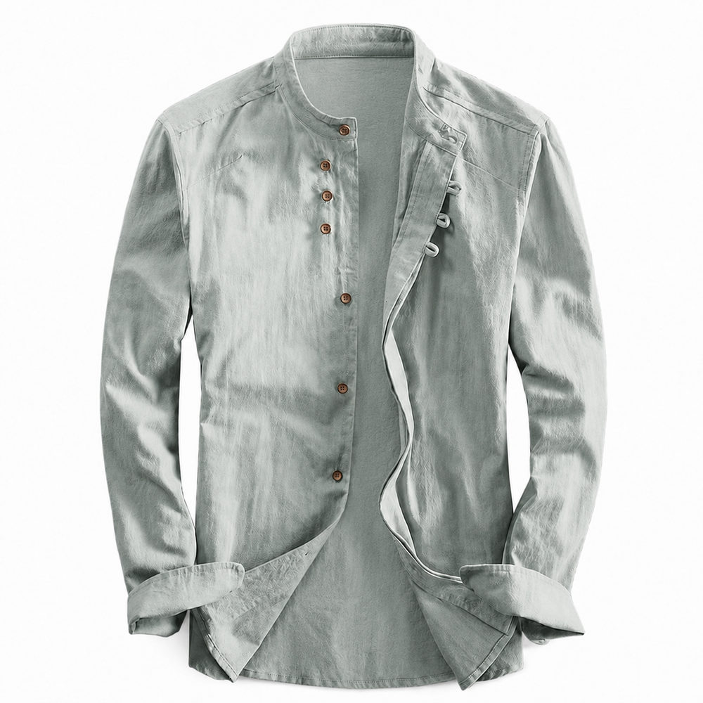 Sage green long sleeve shirt with a stand-up neckline and brown buttons laid flat