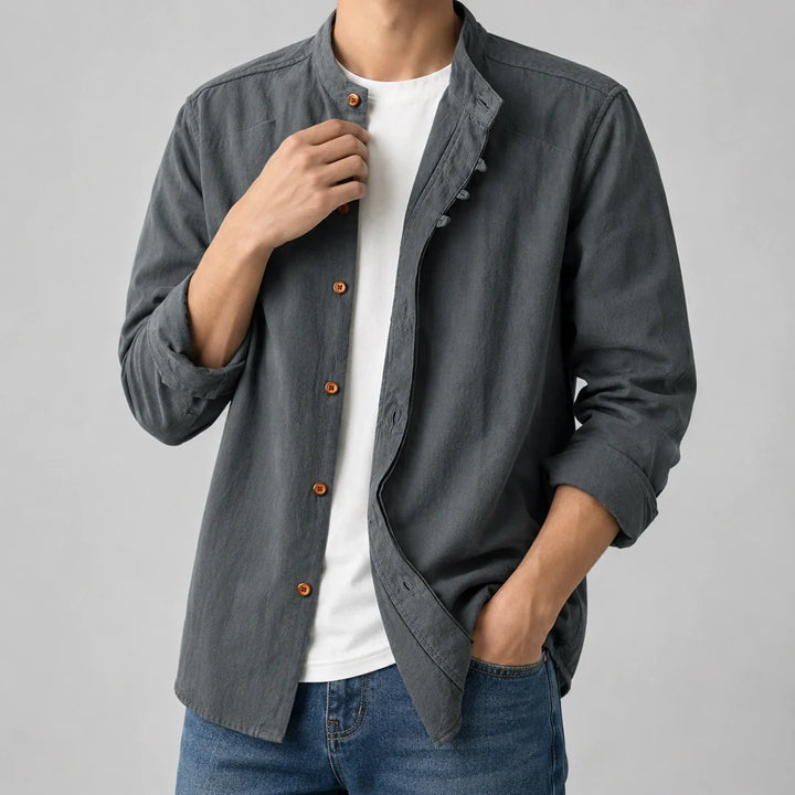 Slate grey long sleeve shirt worn open over a white tee with the sleeves rolled back