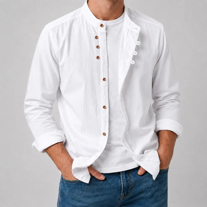 White long sleeve grandad collar shirt worn open over a white tee with denim