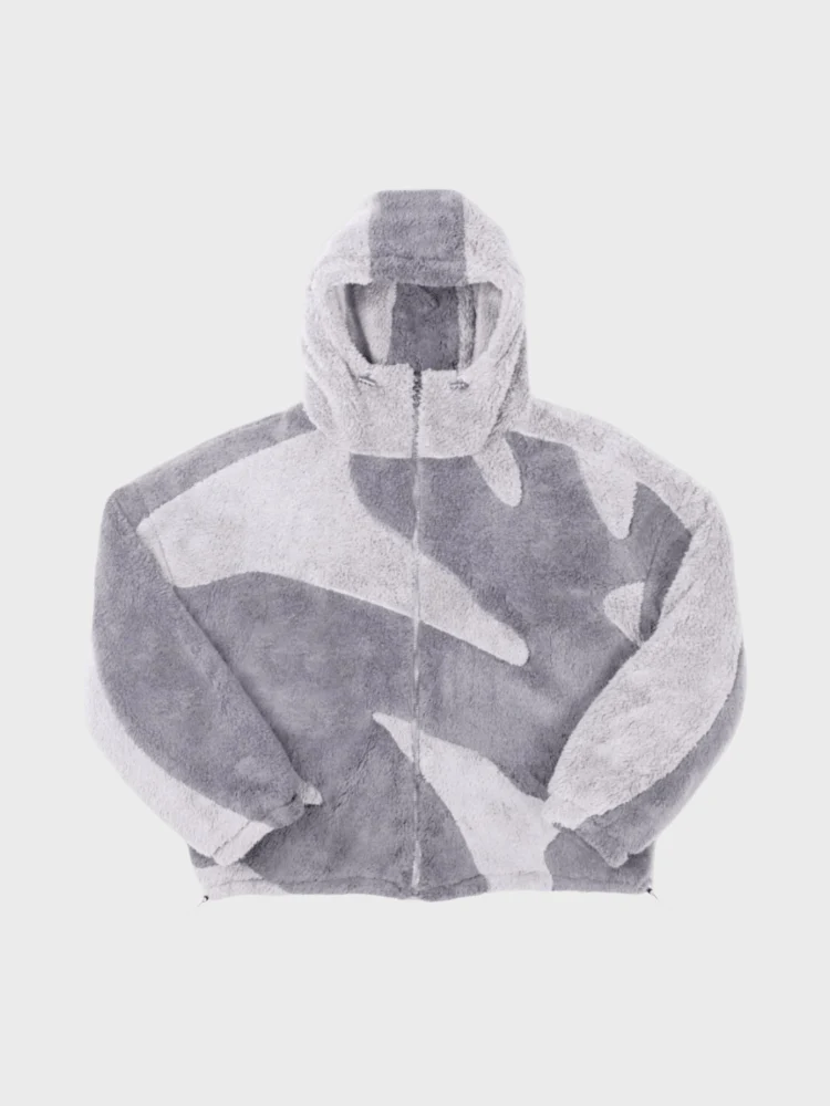 Grey fleece jacket laid flat with the zip open at the hem