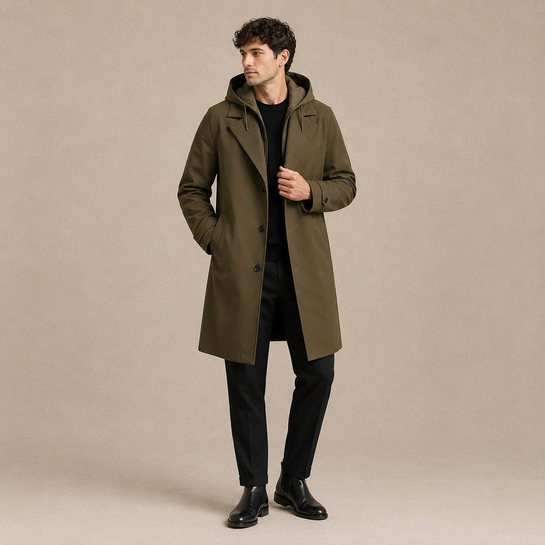 Army green parka coat worn open over a black jumper