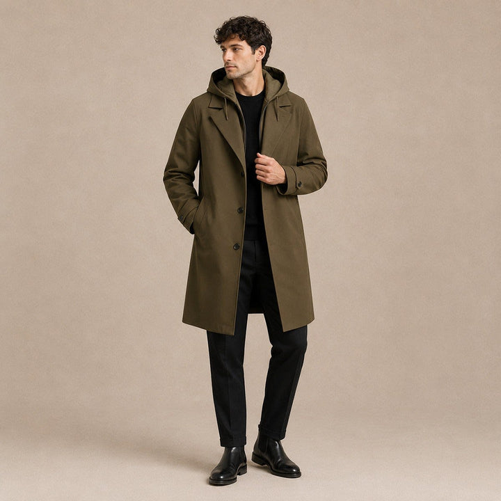 Army green parka coat worn open over a black jumper