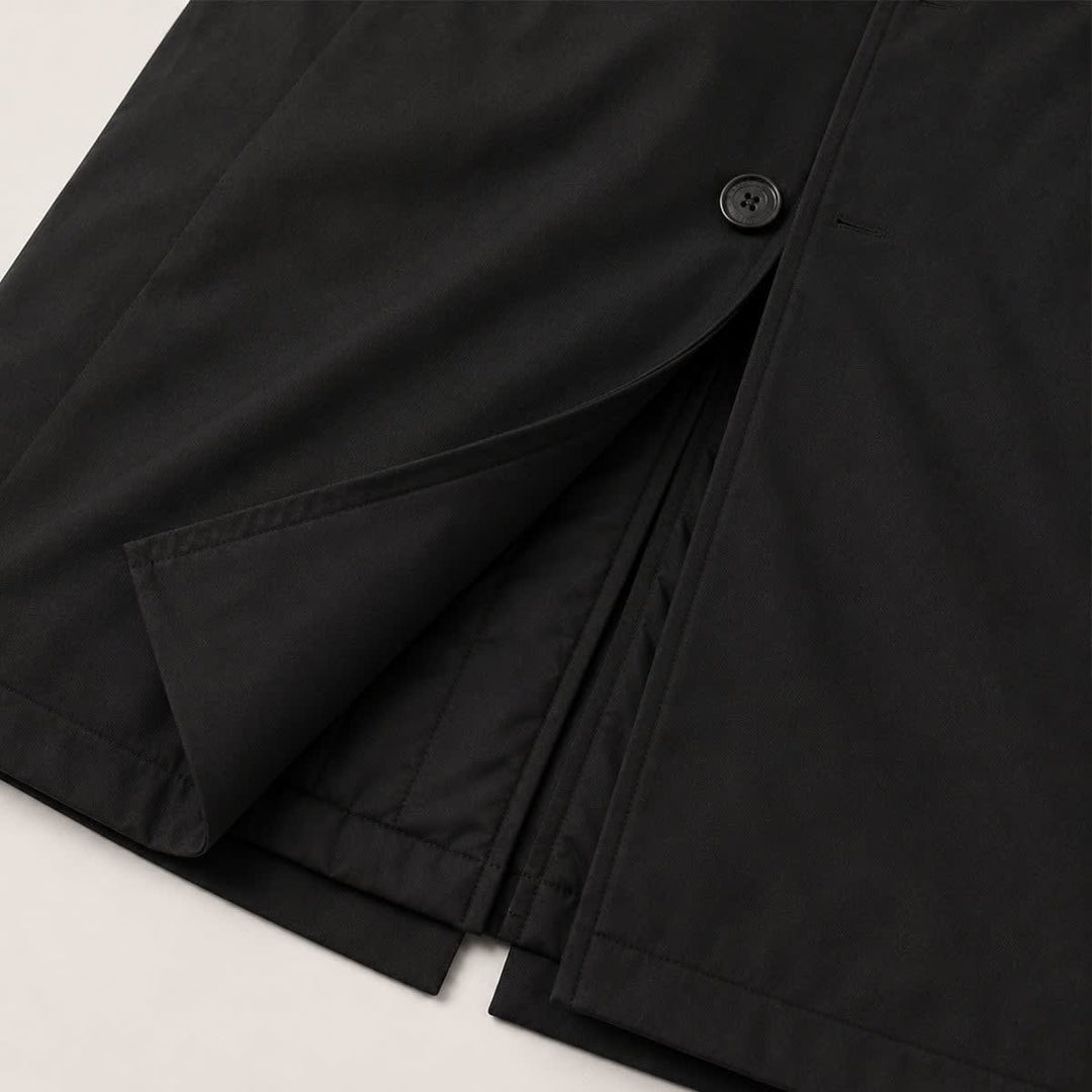 Side pocket and button front detail on the black parka coat
