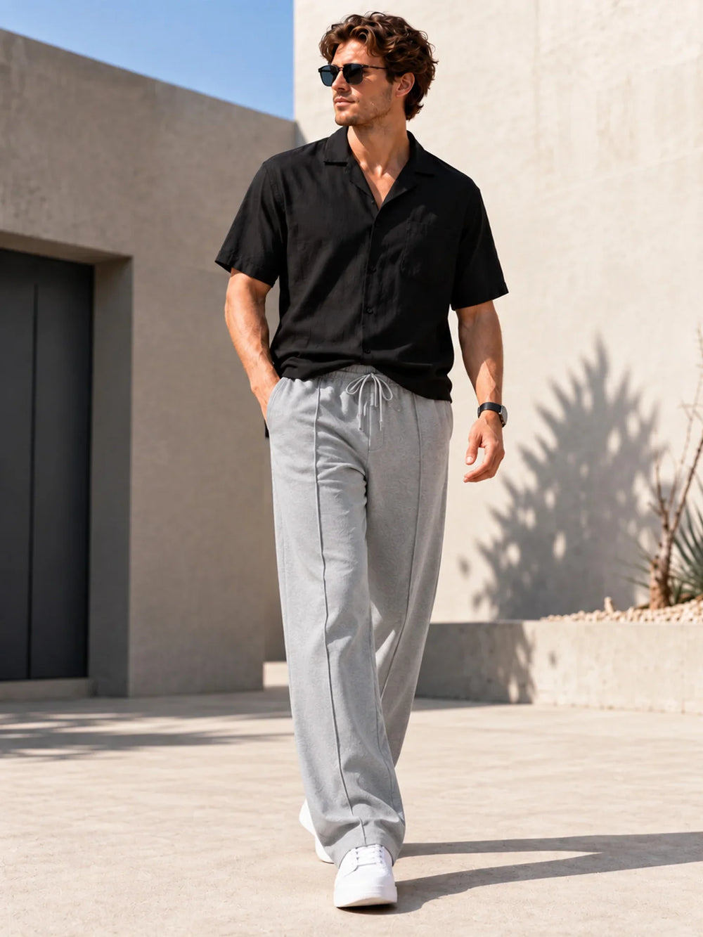 Light grey straight leg joggers with a centre pintuck and drawstring