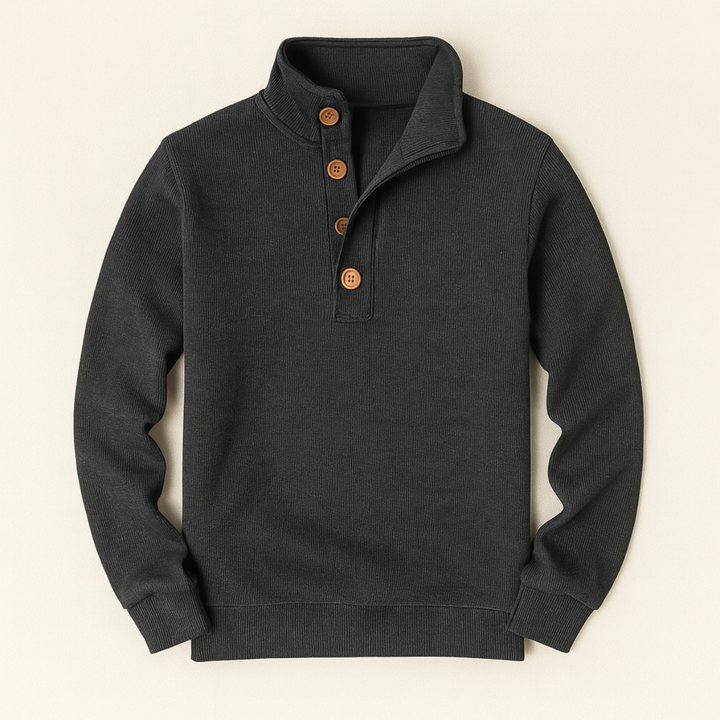 Charcoal grey button neck jumper laid flat on a cream background
