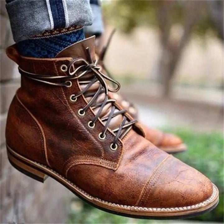 Side view of the brown boot showing the stacked heel and welt