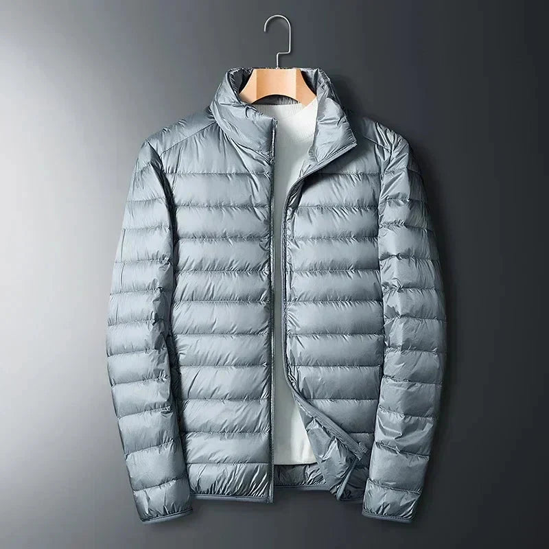 Silver grey quilted puffer jacket with full front zip, open at the neck