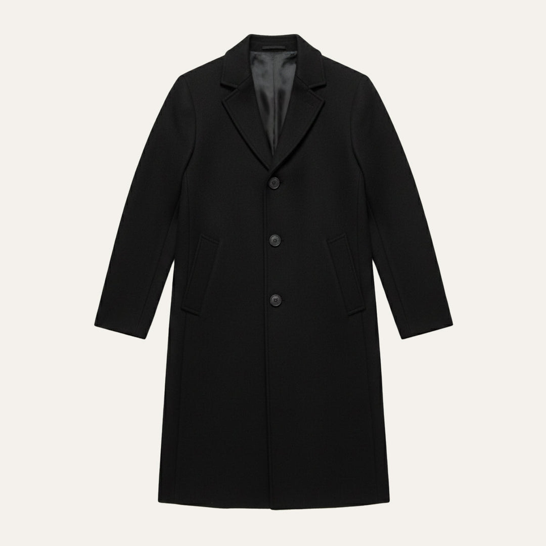 Black overcoat laid flat with the full length visible