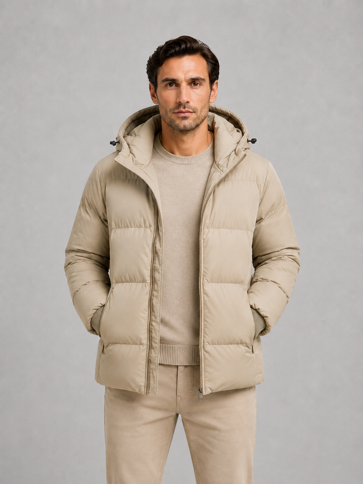 Beige hooded puffer jacket worn open over a matching jumper
