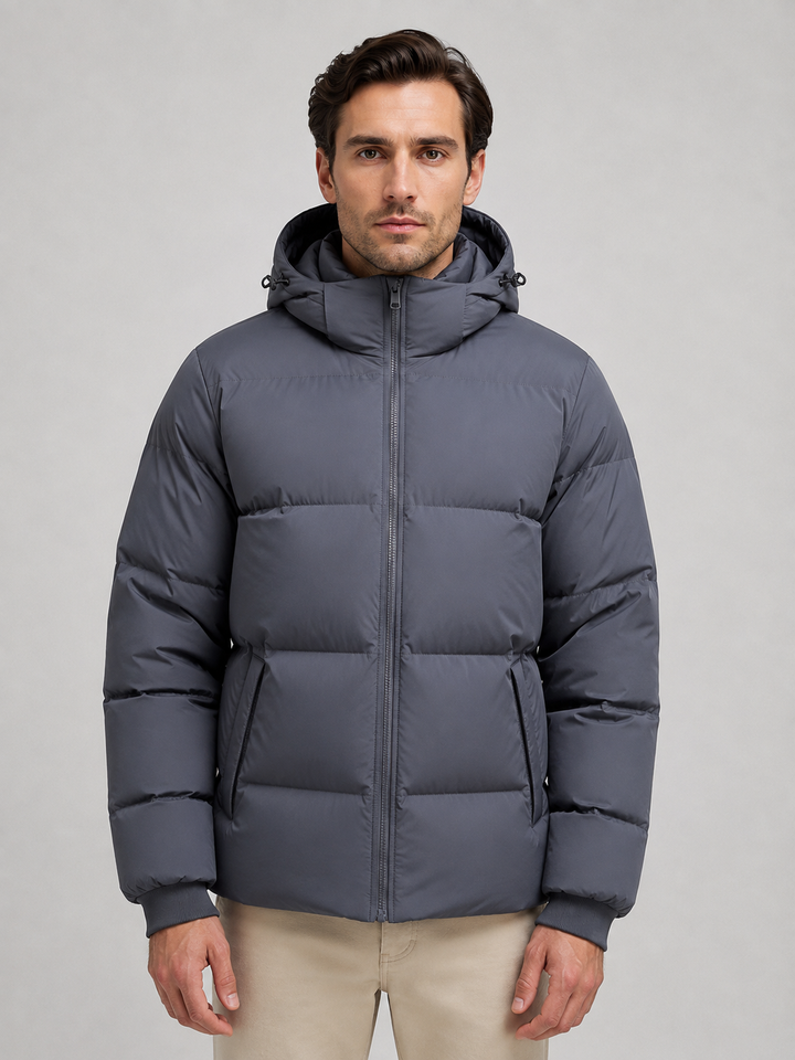 Dark grey hooded puffer jacket zipped up, front view