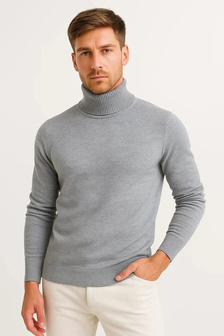 Grey knitted turtleneck on a model, showing the folded collar and ribbed hem