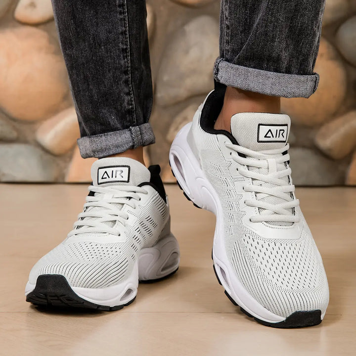 White Black trainers, worn on foot, side view