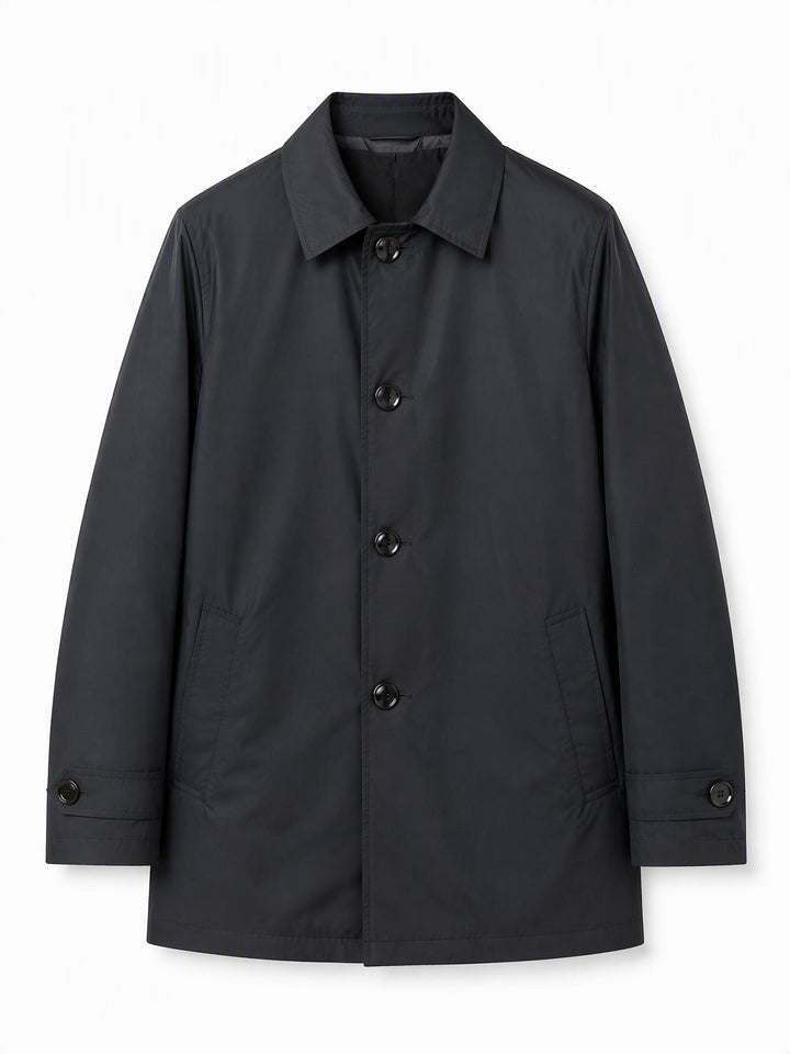 Black single breasted coat laid flat showing a point collar and four buttons