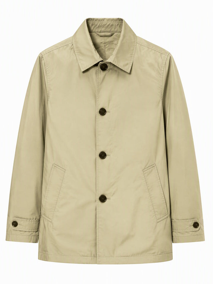 Khaki coat shown close up with four buttons along the front