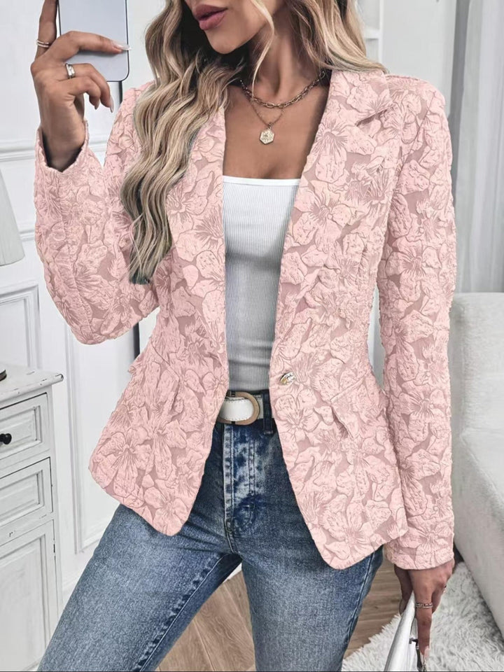 Pink raised floral blazer worn open with denim