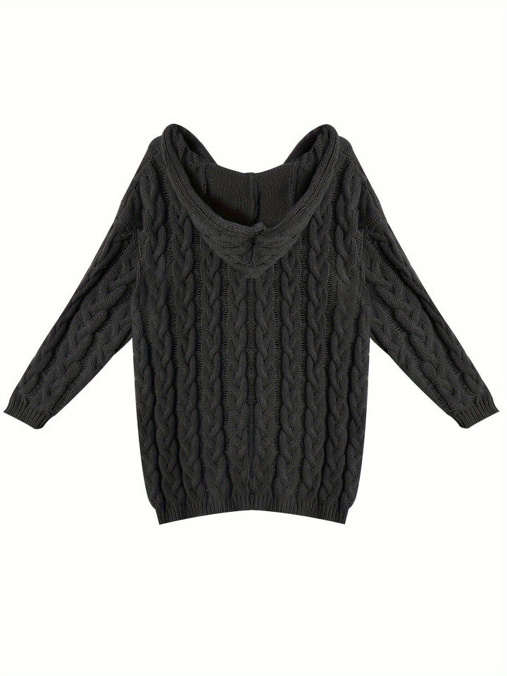 Black oversized cable knit jumper laid flat with the hood up