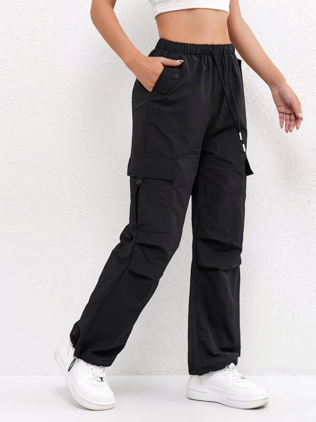 Women's cargo trousers in black, parachute drawstring hem wide leg