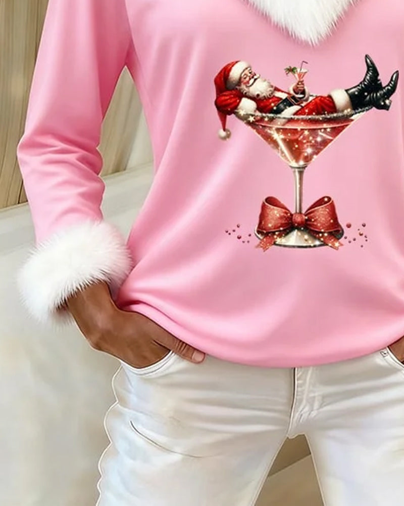 Pink top sleeve with fluffy cuff beside the Santa print