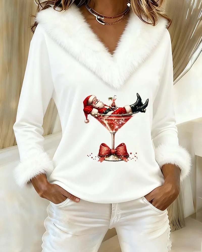White Christmas top with fluffy V neck and cuffs, hands in pockets
