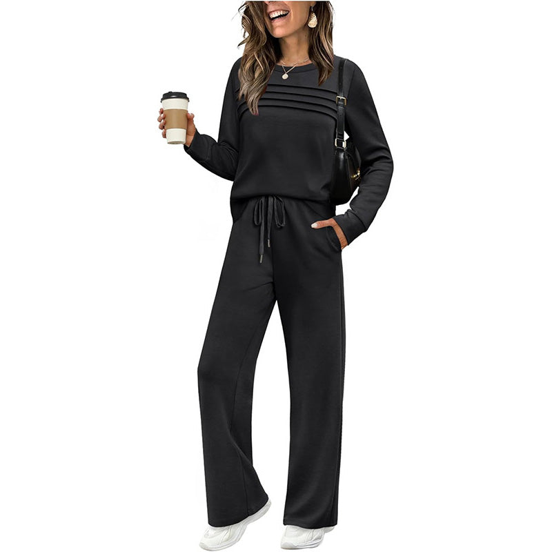 Black crew neck lounge top with tuck lines and wide leg drawstring trousers