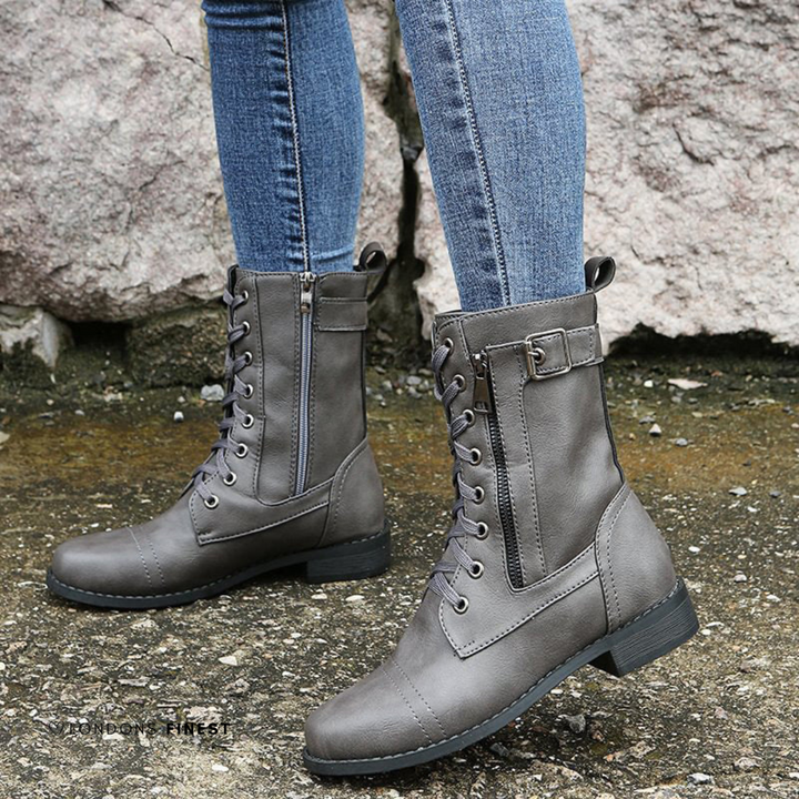 Grey lace up boots with side zip and buckle, worn with jeans