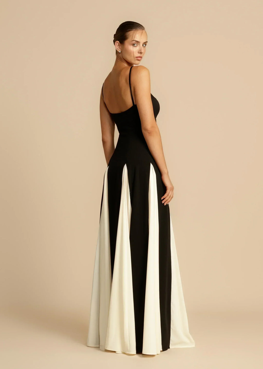Side back view with slim spaghetti straps and floor length skirt