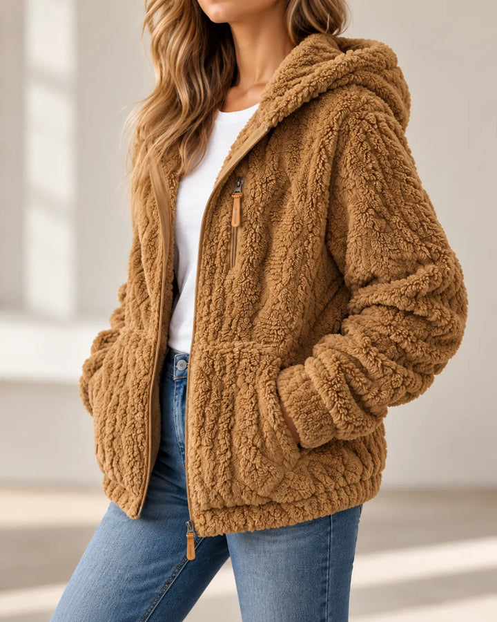 Camel teddy jacket at an angle, showing the hood and hip pocket