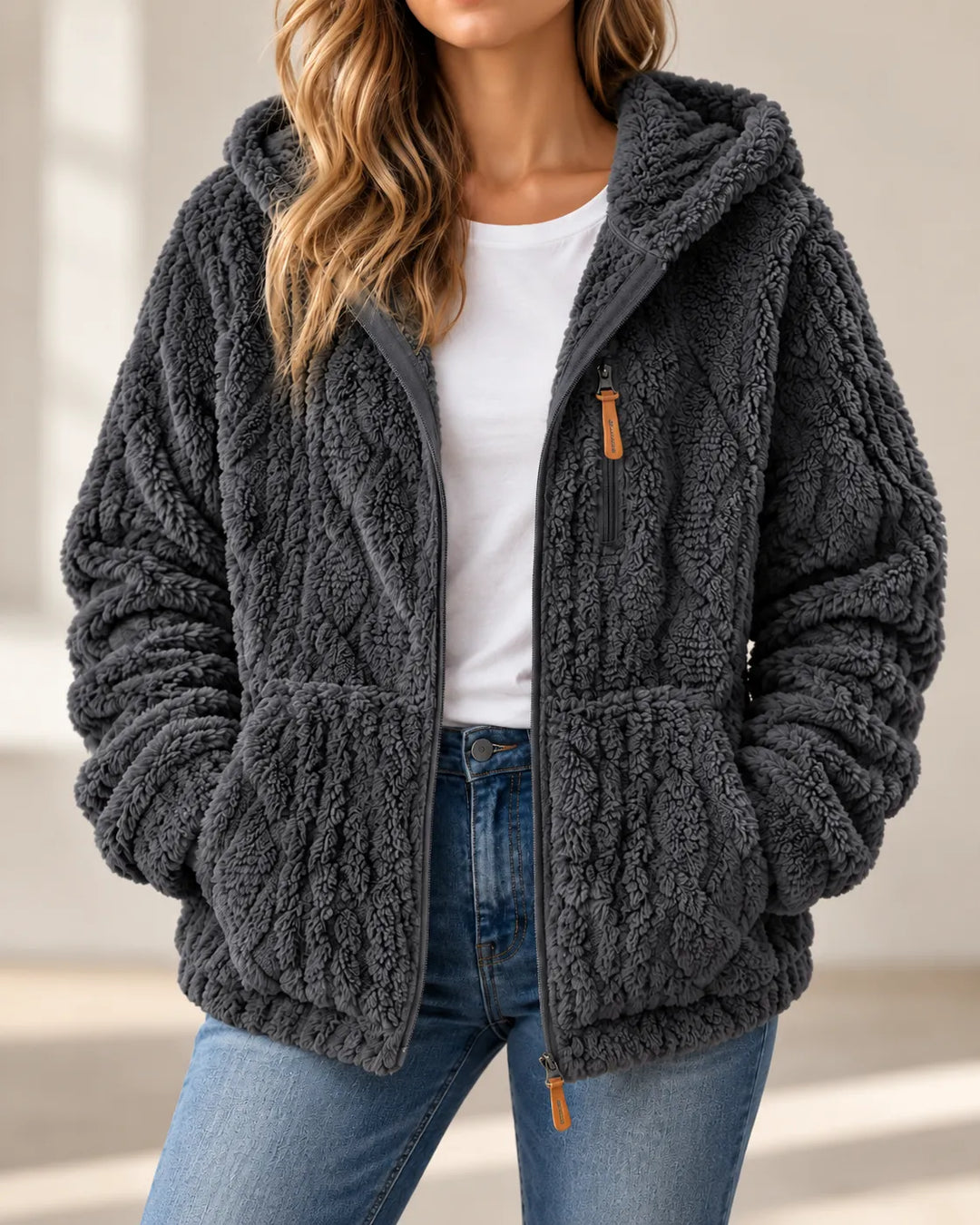 Charcoal grey hooded teddy jacket worn open over a white tee