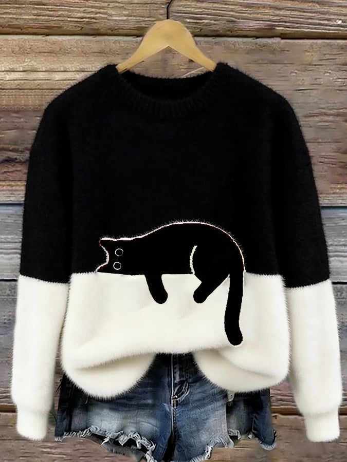 Black and cream fluffy jumper with a black cat outlined in white